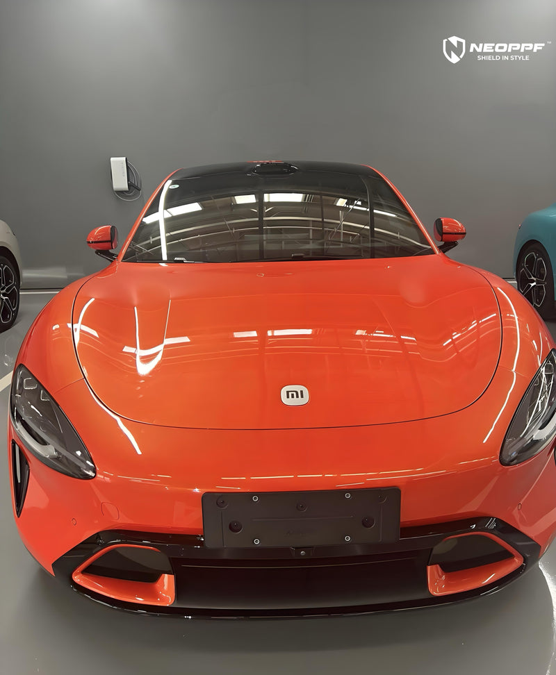 Xiaomi SU7 in orange colored paint protection film — SU7 PPF and colour change guide 2026