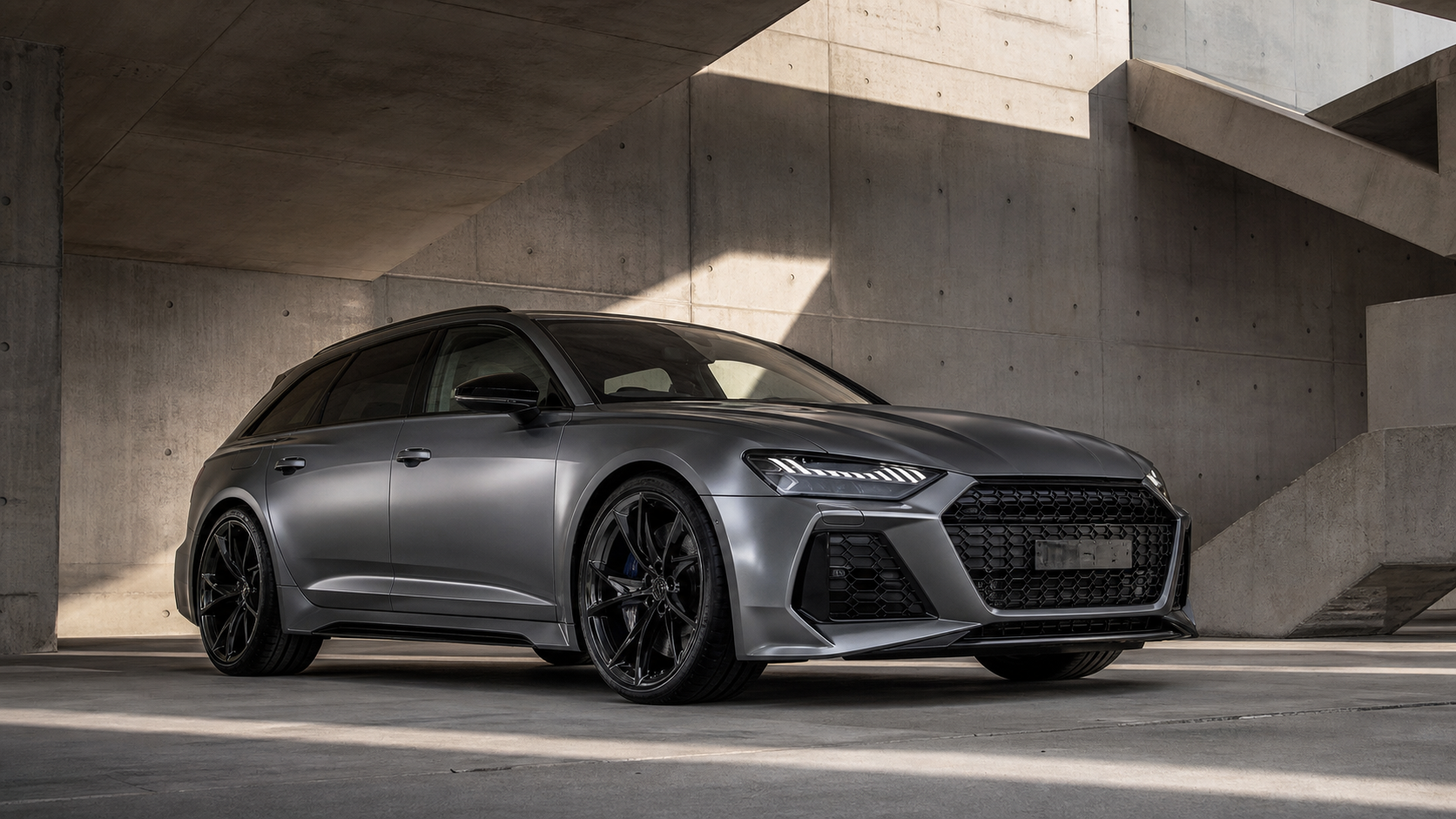 Unbranded nano gray sports wagon in a concrete parking structure