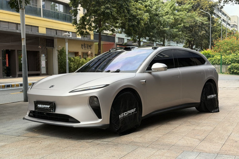 Silver NEOPPF media vehicle in a front-side view with mirror and doors visible