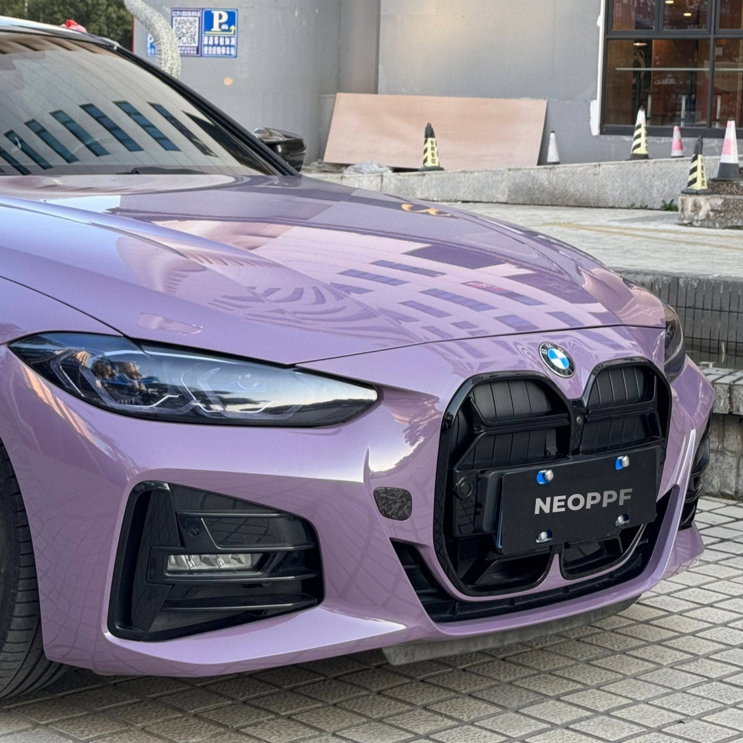 A sports car with Provence Purple paint protection film colored wrap is parking in the garage