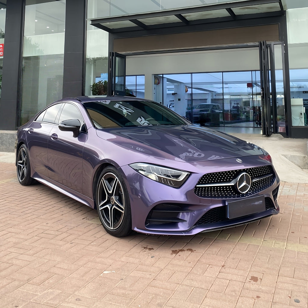 A sports car with Grayish Violet paint protection film colored wrap is parking in the garage