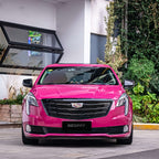 A sports car with Starlight Ruby Red paint protection film colored wrap is parking in the garage