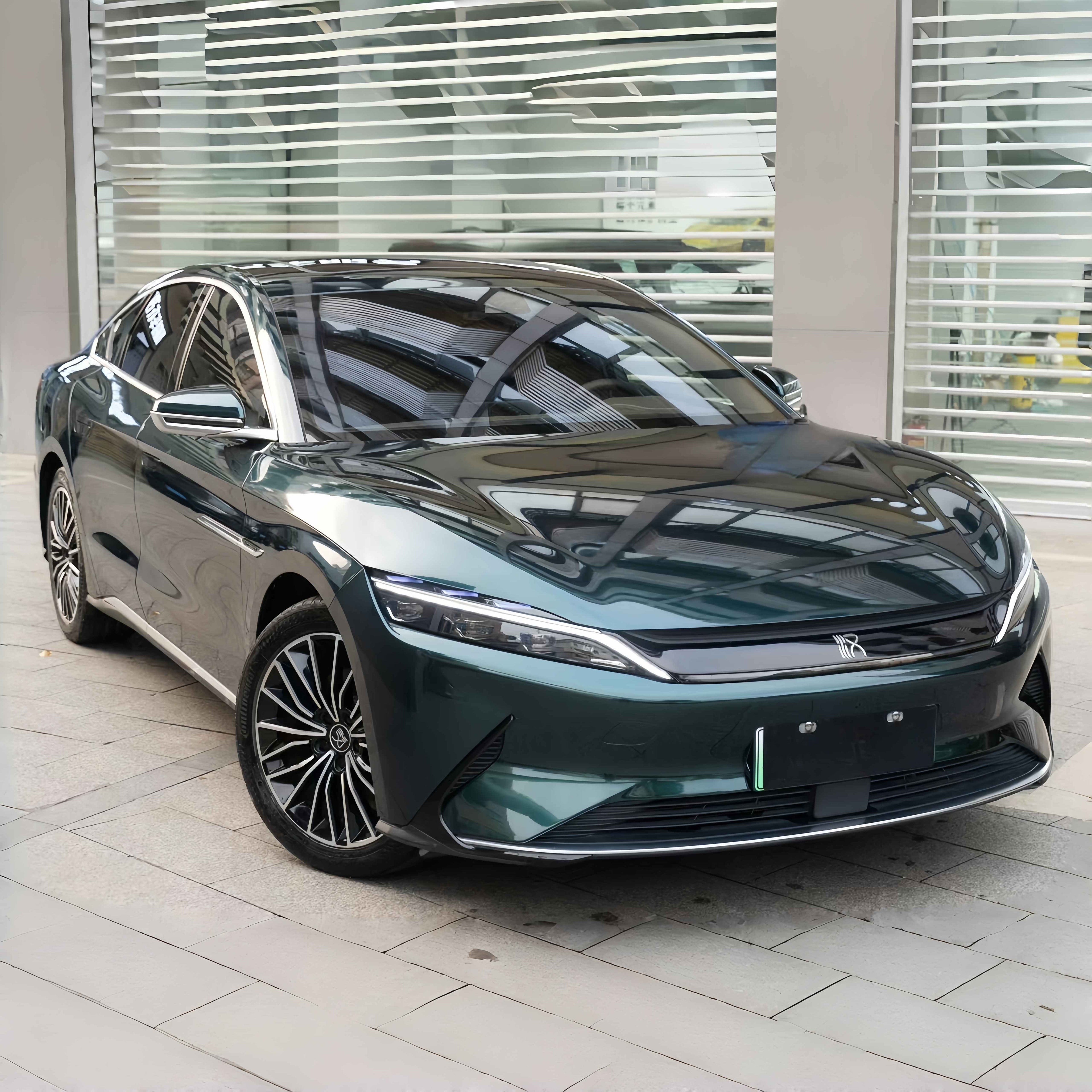 A sports car with Verdant Green paint protection film colored wrap is parking in the garage