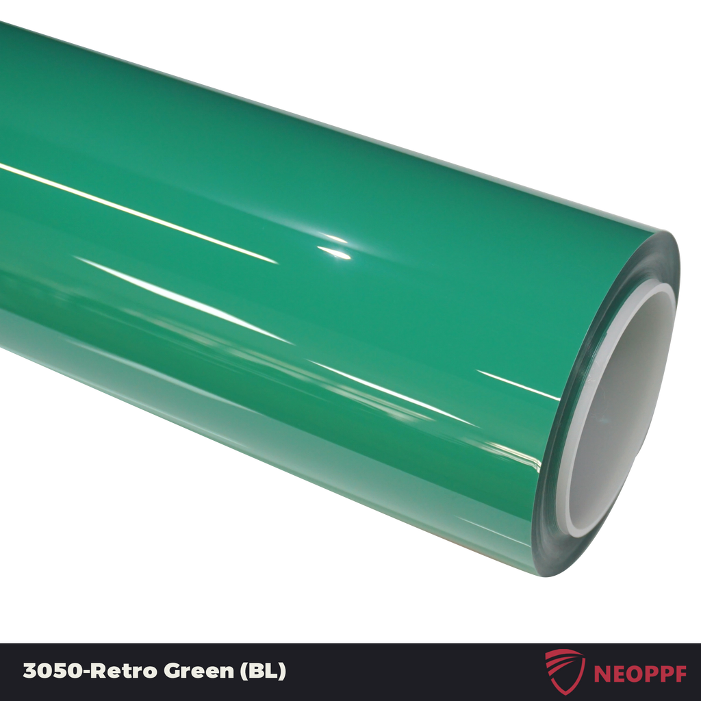 A sports car with Retro Green paint protection film colored wrap is parking in the garage