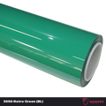 A sports car with Retro Green paint protection film colored wrap is parking in the garage