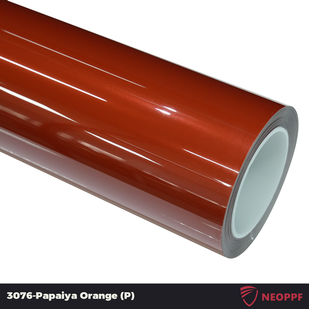 A sports car with Papaiya Orange paint protection film colored wrap is parking in the garage