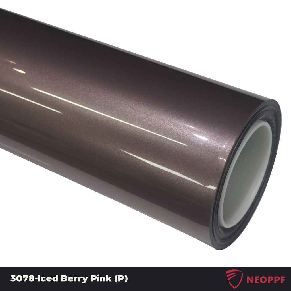 A sports car with Iced Berry Pink paint protection film colored wrap is parking in the garage
