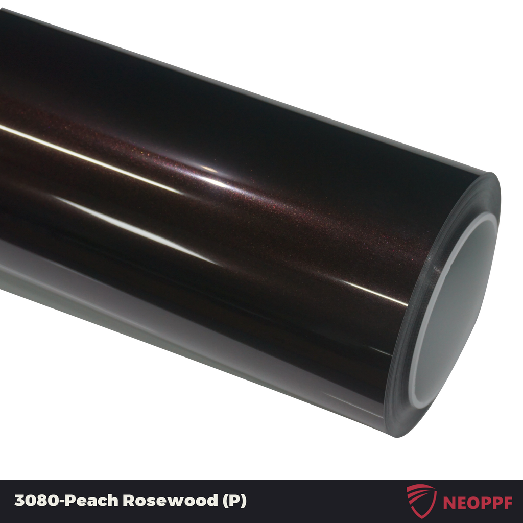 A sports car with Peach Rosewood paint protection film colored wrap is parking in the garage