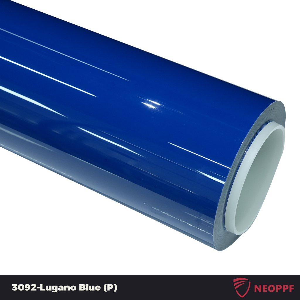 A sports car with Lugano Blue paint protection film colored wrap is parking in the garage