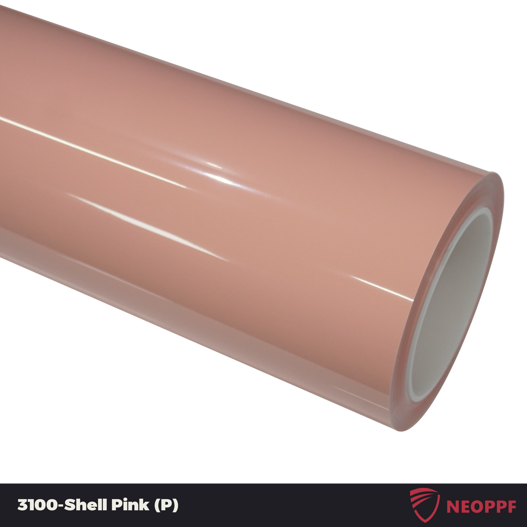 A sports car with Shell Pink paint protection film colored wrap is parking in the garage