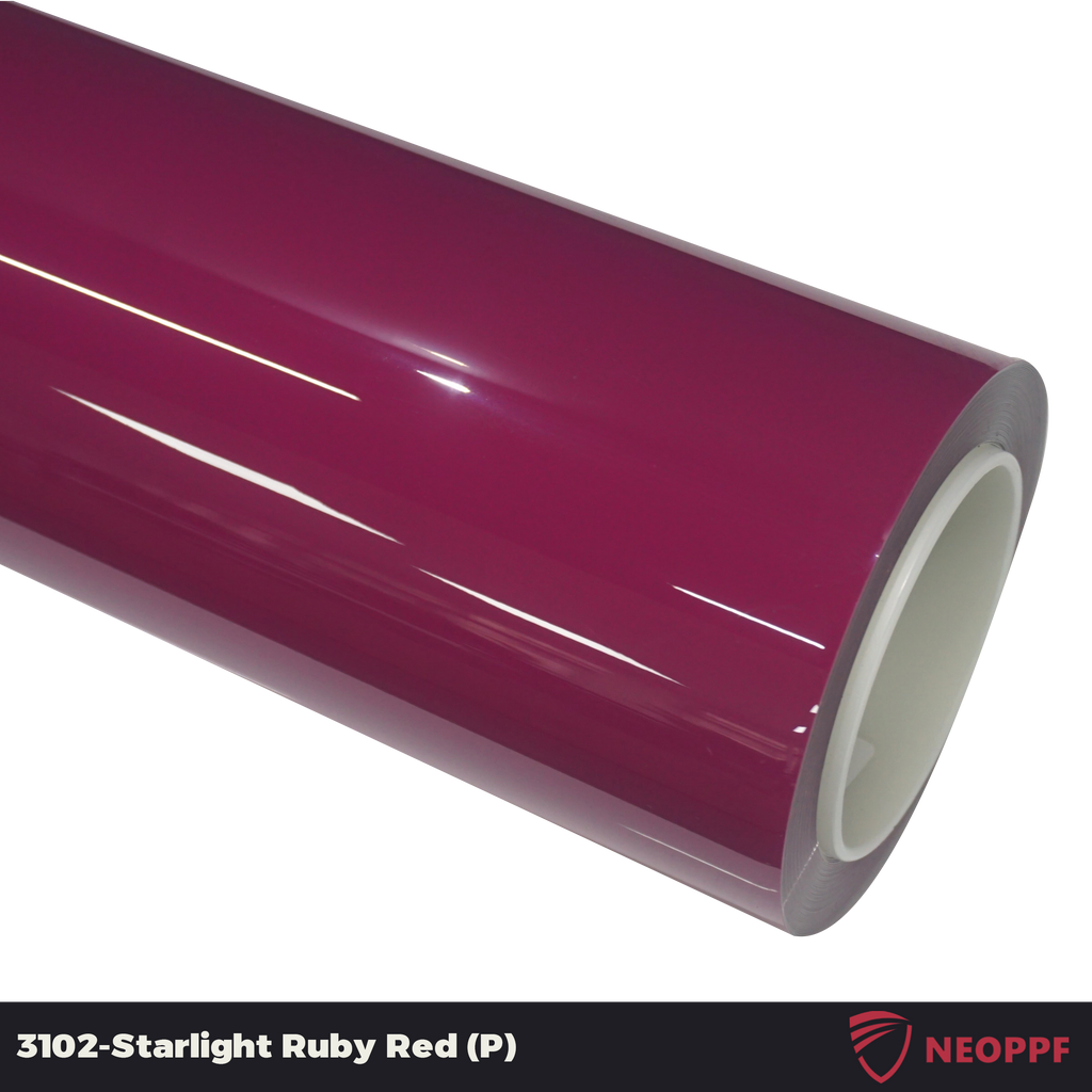 A sports car with Starlight Ruby Red paint protection film colored wrap is parking in the garage