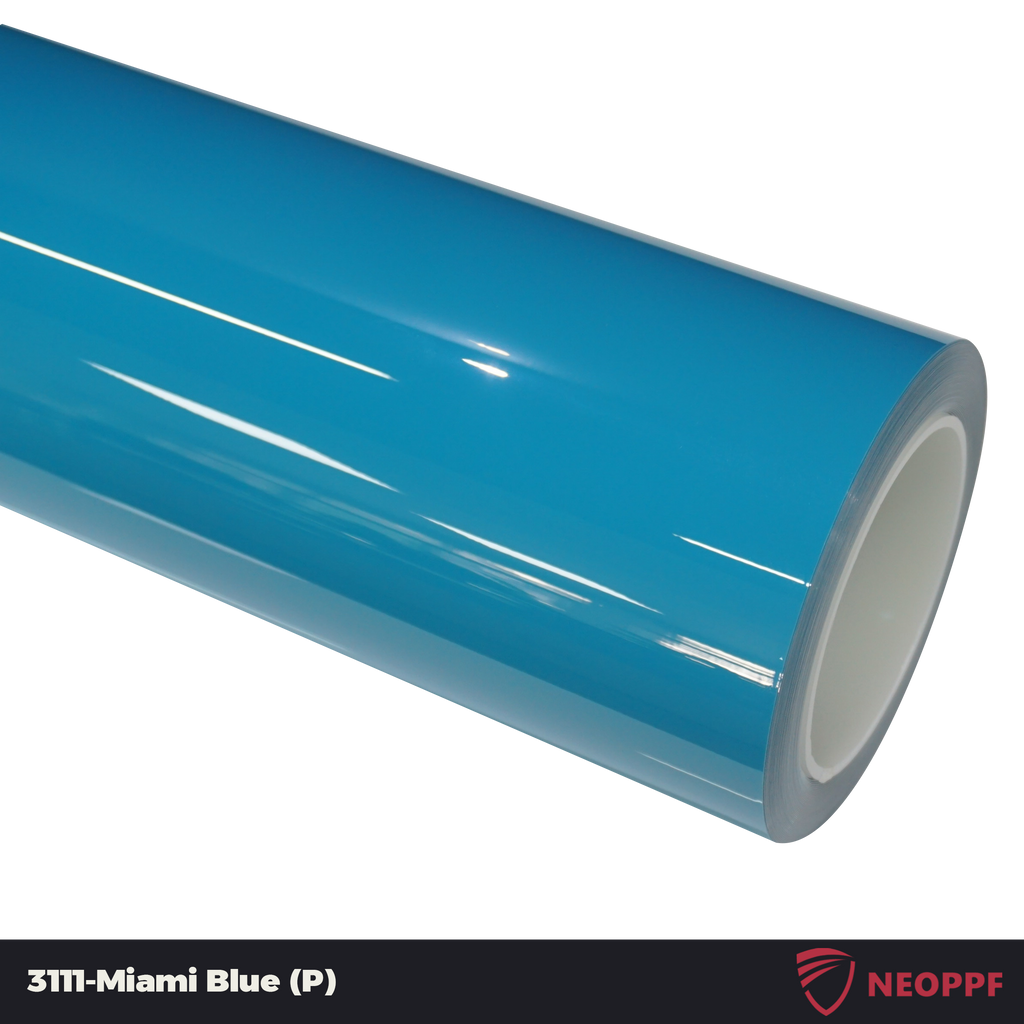 A sports car with Miami Blue paint protection film colored wrap is parking in the garage