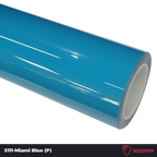 A sports car with Miami Blue paint protection film colored wrap is parking in the garage