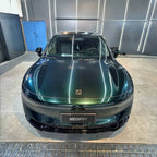 A sports car with Sand Green paint protection film colored wrap is parking in the garage