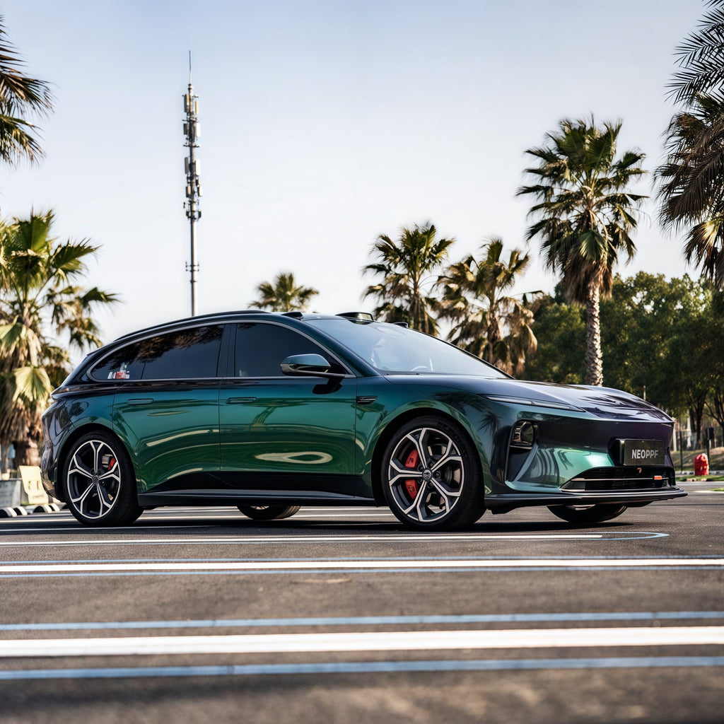 A sports car with Diamond Aurora Green paint protection film colored wrap is parking in the garage
