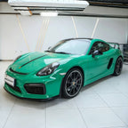 A sports car with Retro Green paint protection film colored wrap is parking in the garage