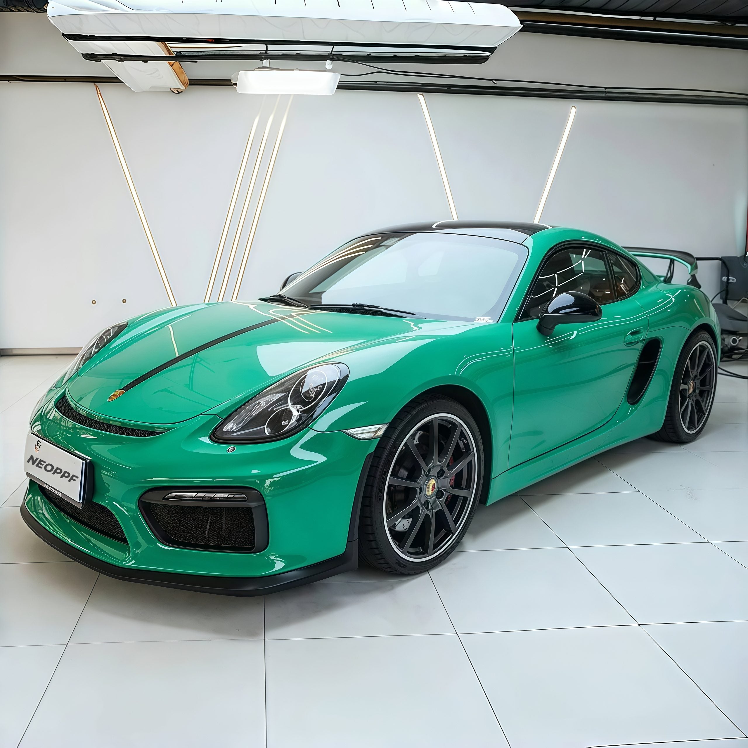 A sports car with Retro Green paint protection film colored wrap is parking in the garage