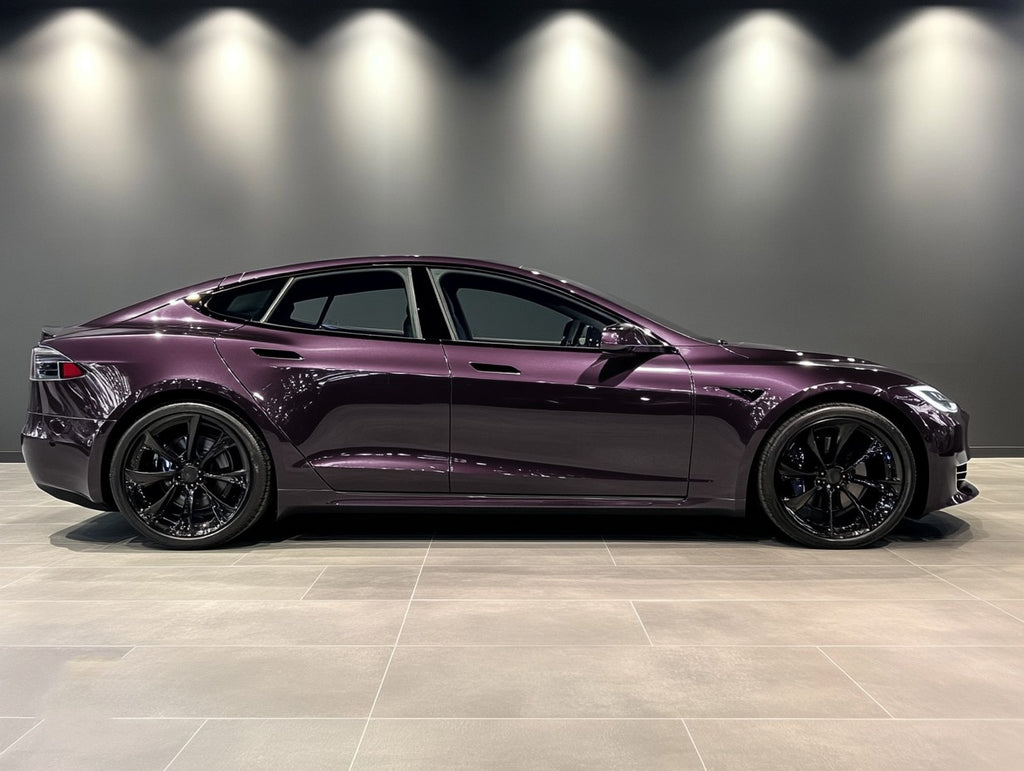 A sports car with Leblon Violet Metallic paint protection film colored wrap is parking in the garage