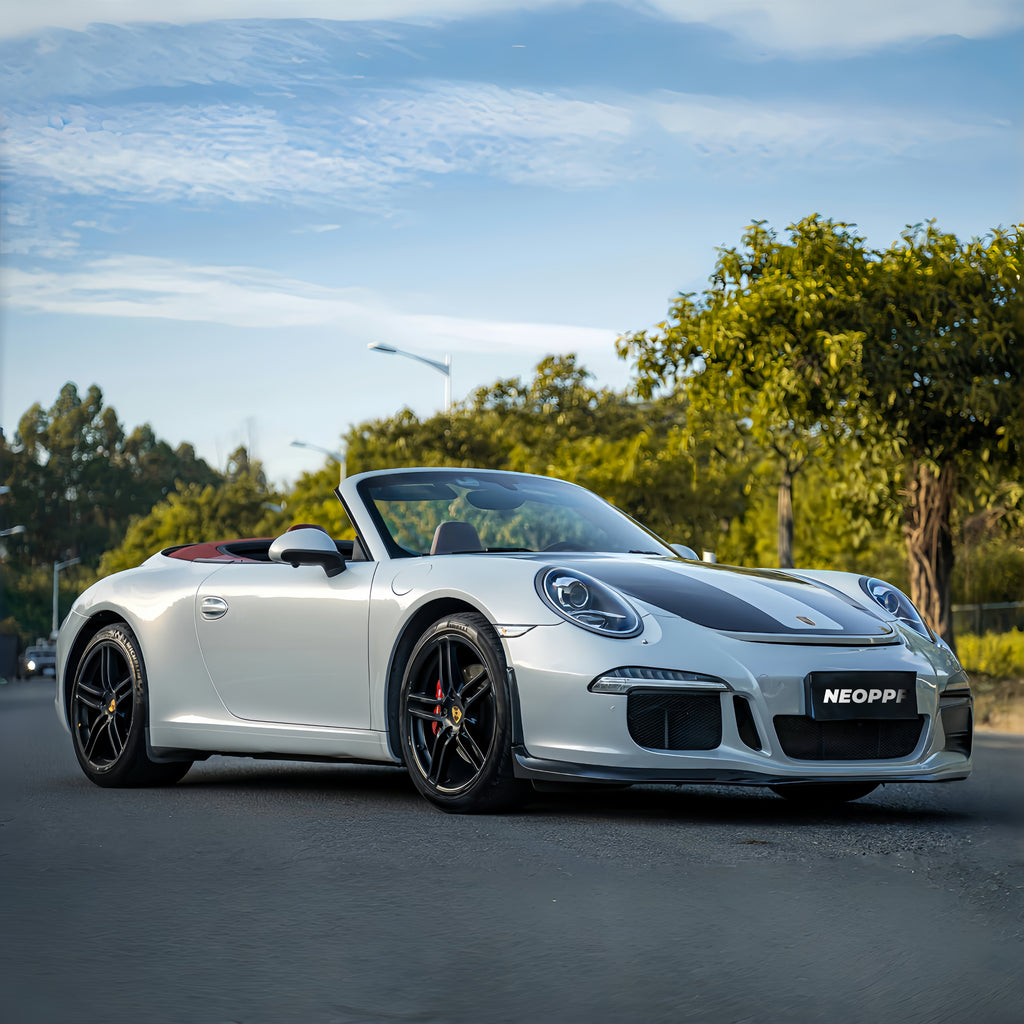 A sports car with Silver Fox Gray paint protection film colored wrap is parking in the garage
