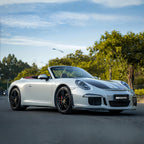 A sports car with Silver Fox Gray paint protection film colored wrap is parking in the garage