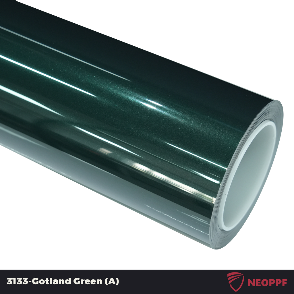 A sports car with Gotland Green paint protection film colored wrap is parking in the garage