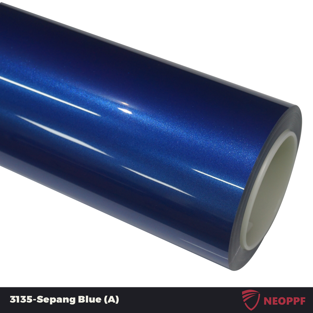 A sports car with Sepang Blue paint protection film colored wrap is parking in the garage