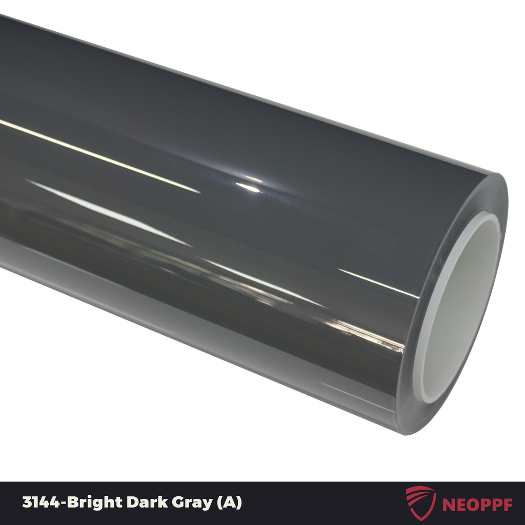 A sports car with Bright Dark Gray paint protection film colored wrap is parking in the garage