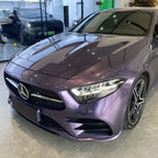 A sports car with Grayish Violet paint protection film colored wrap is parking in the garage