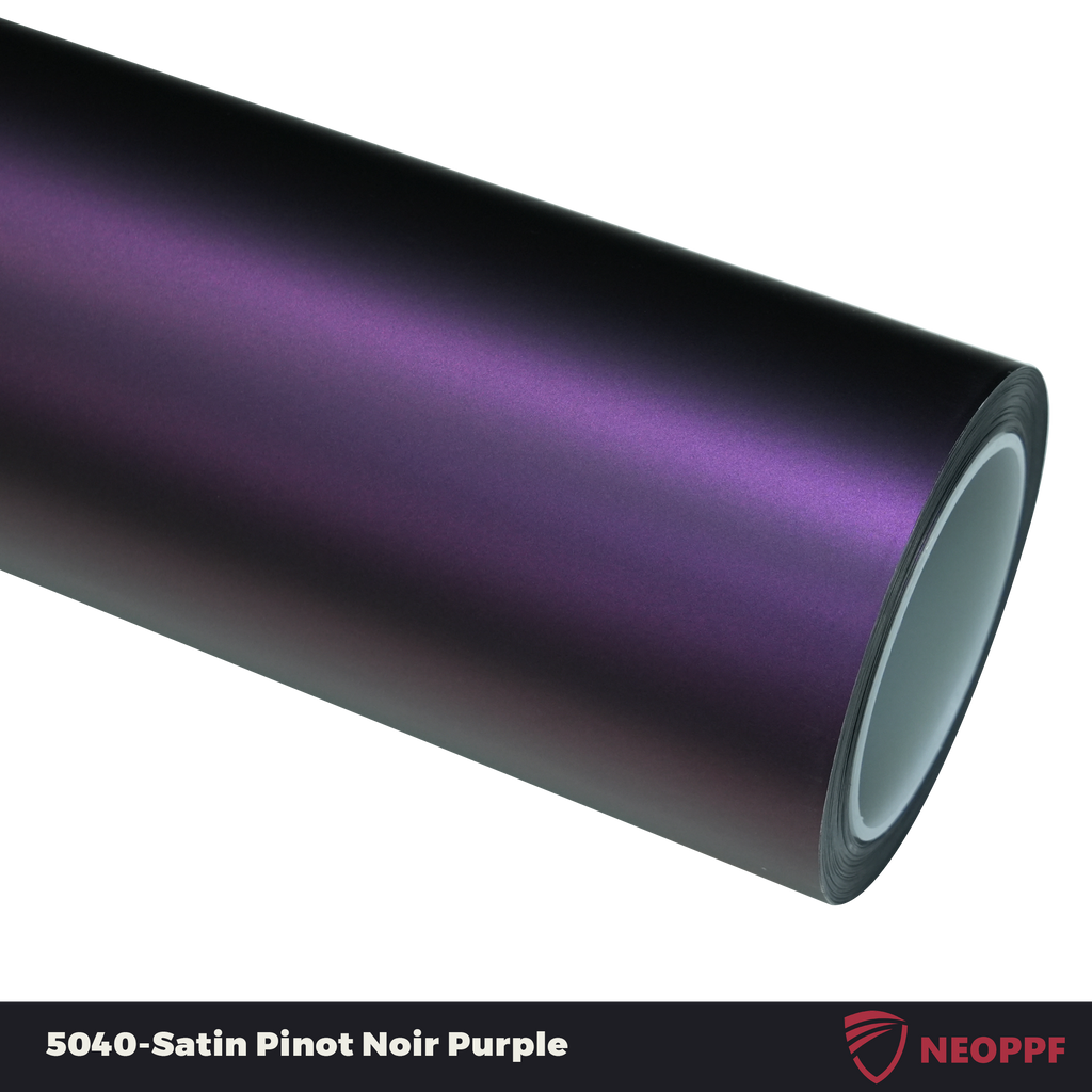A sports car with Satin Pinot Noir Purple paint protection film colored wrap is parking in the garage