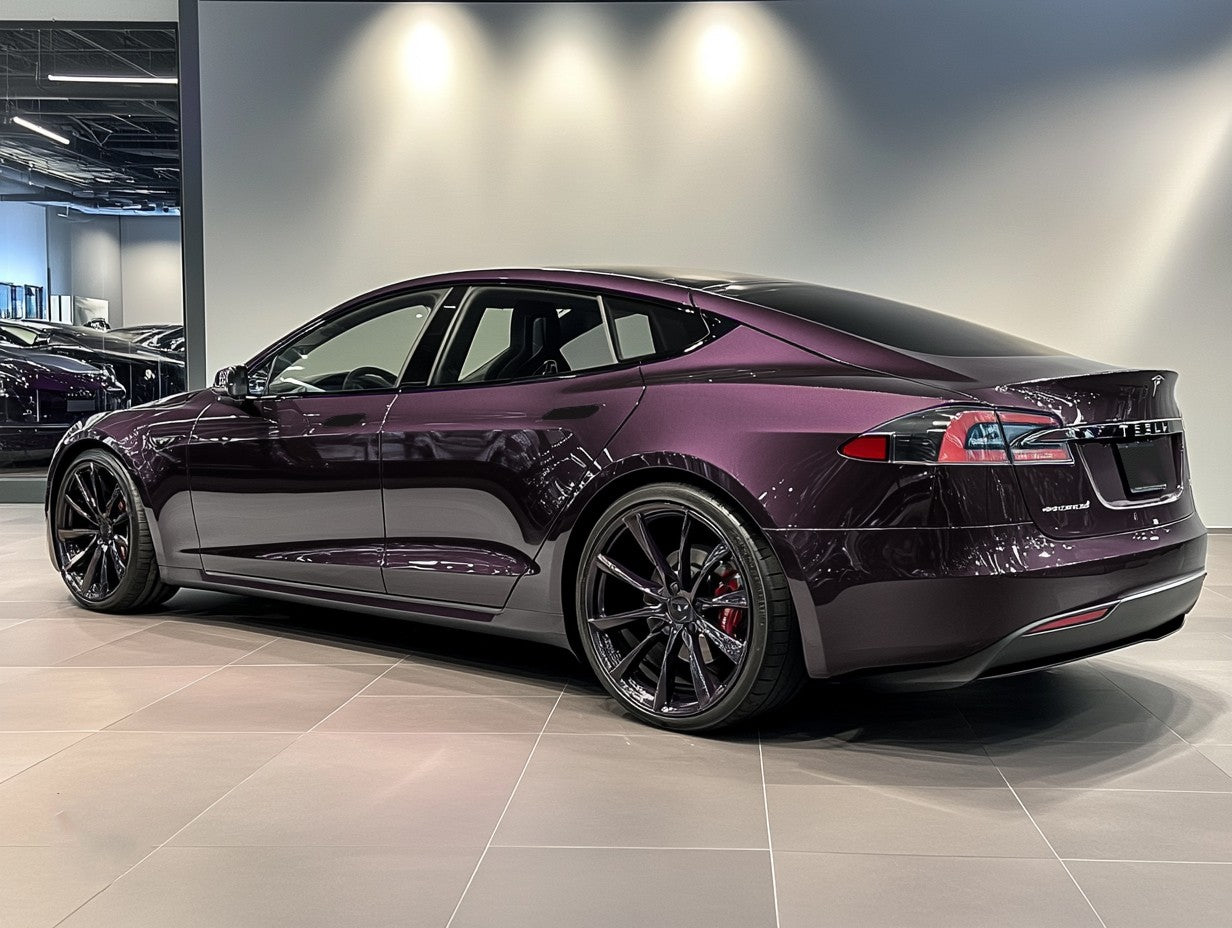 A sports car with Leblon Violet Metallic paint protection film colored wrap is parking in the garage