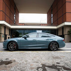 A sports car with Eucalyptus Blue paint protection film colored wrap is parking in the garage
