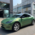 A sports car with Rainbow Emerald paint protection film colored wrap is parking in the garage