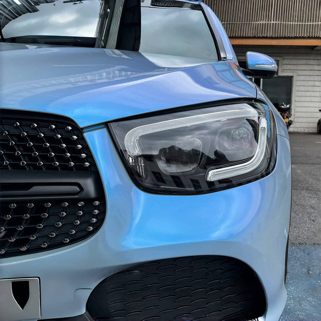 A sports car with Rock Gray paint protection film colored wrap is parking in the garage