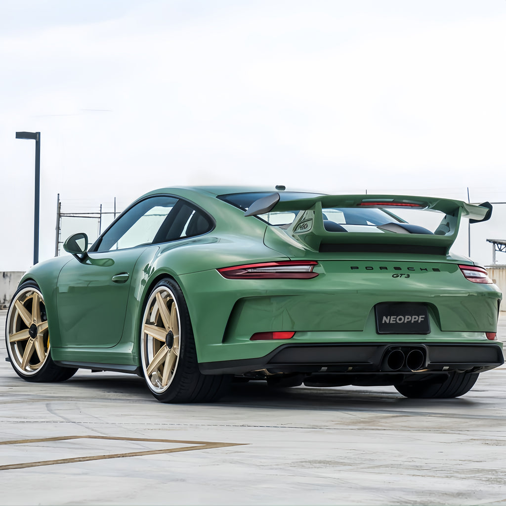 A sports car with Onium Green paint protection film colored wrap is parking in the garage