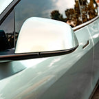 A sports car with Hardlin Green paint protection film colored wrap is parking in the garage