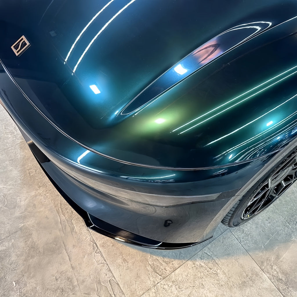 A sports car with Sand Green paint protection film colored wrap is parking in the garage