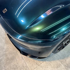 A sports car with Sand Green paint protection film colored wrap is parking in the garage