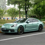 A sports car with Francesca Green paint protection film colored wrap is parking in the garage