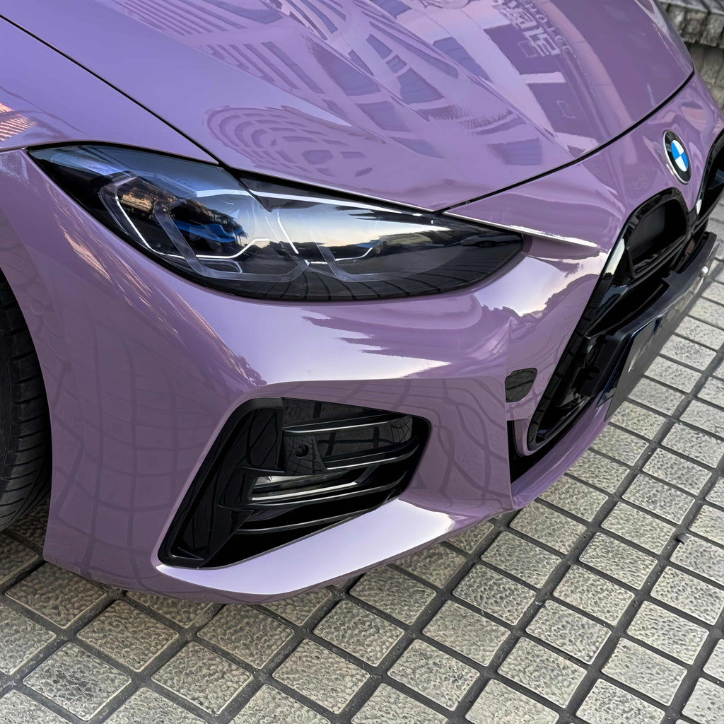 A sports car with Provence Purple paint protection film colored wrap is parking in the garage