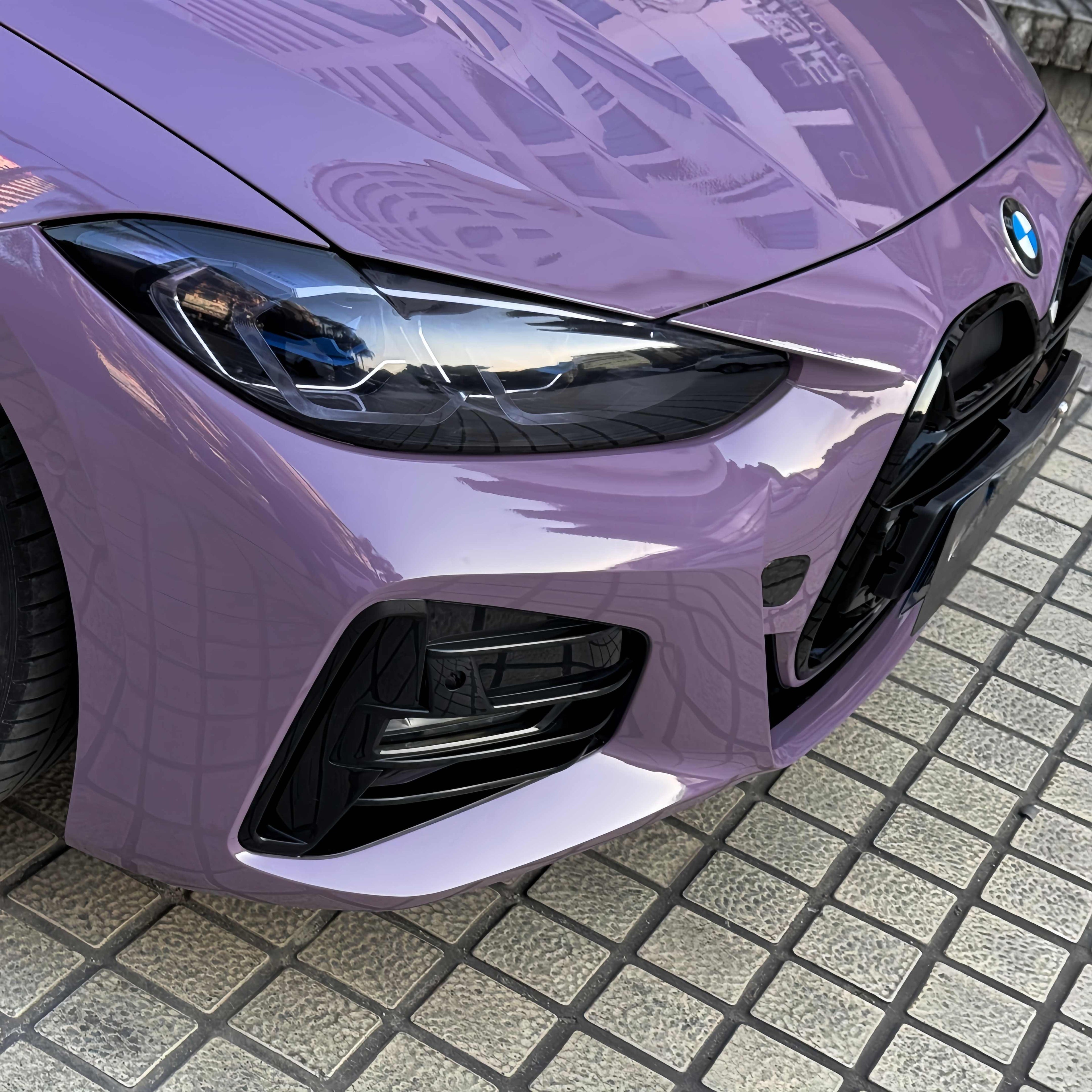 A sports car with Provence Purple paint protection film colored wrap is parking in the garage