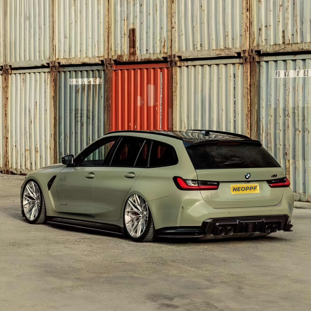 A sports car with Armoured Green paint protection film colored wrap is parking in the garage