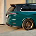 A sports car with Green Hell paint protection film colored wrap is parking in the garage
