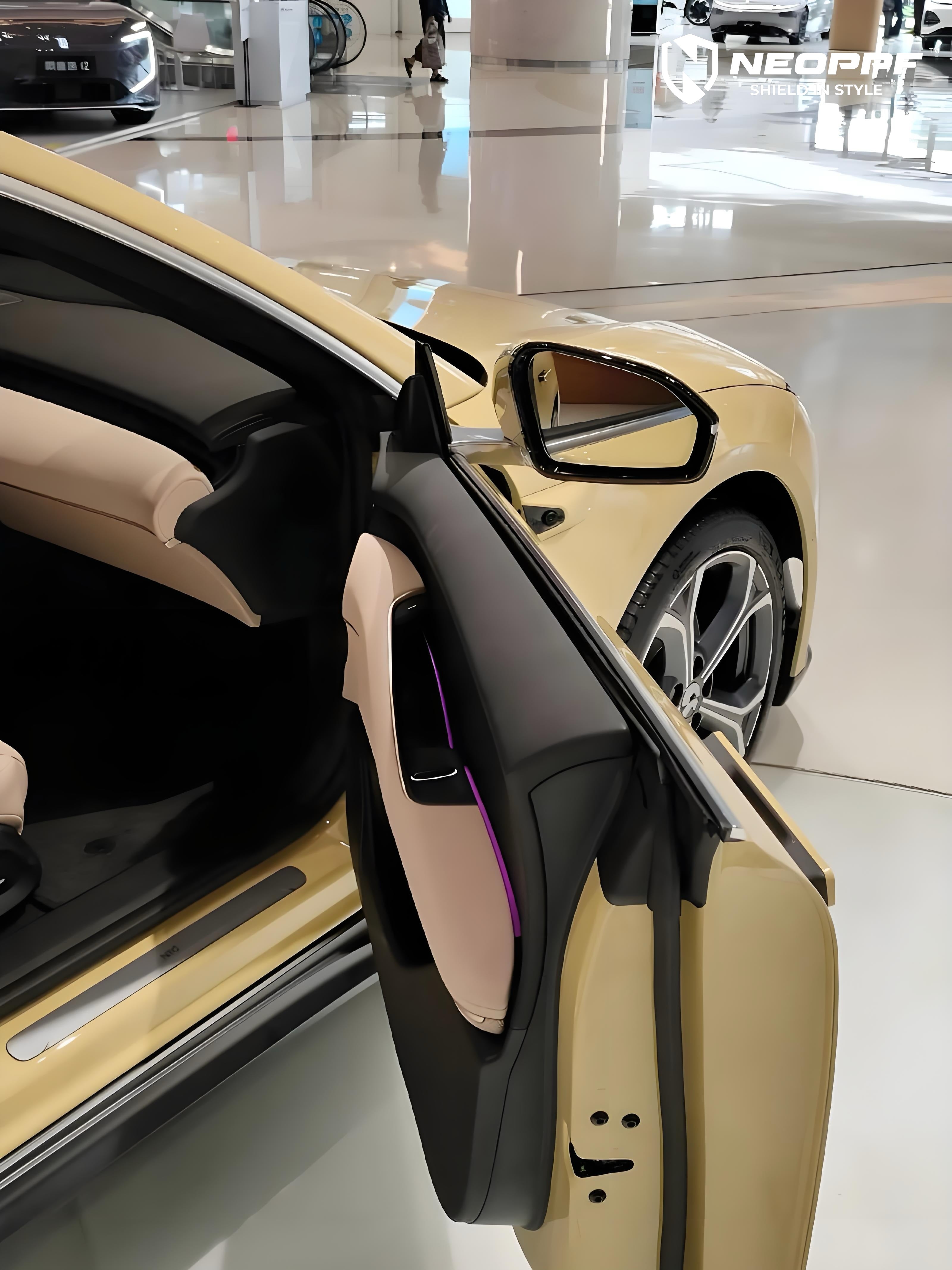 A sports car with Cream Yellow paint protection film colored wrap is parking in the garage