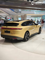 A sports car with Cream Yellow paint protection film colored wrap is parking in the garage