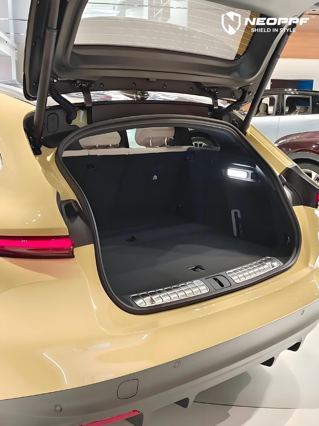 A sports car with Cream Yellow paint protection film colored wrap is parking in the garage