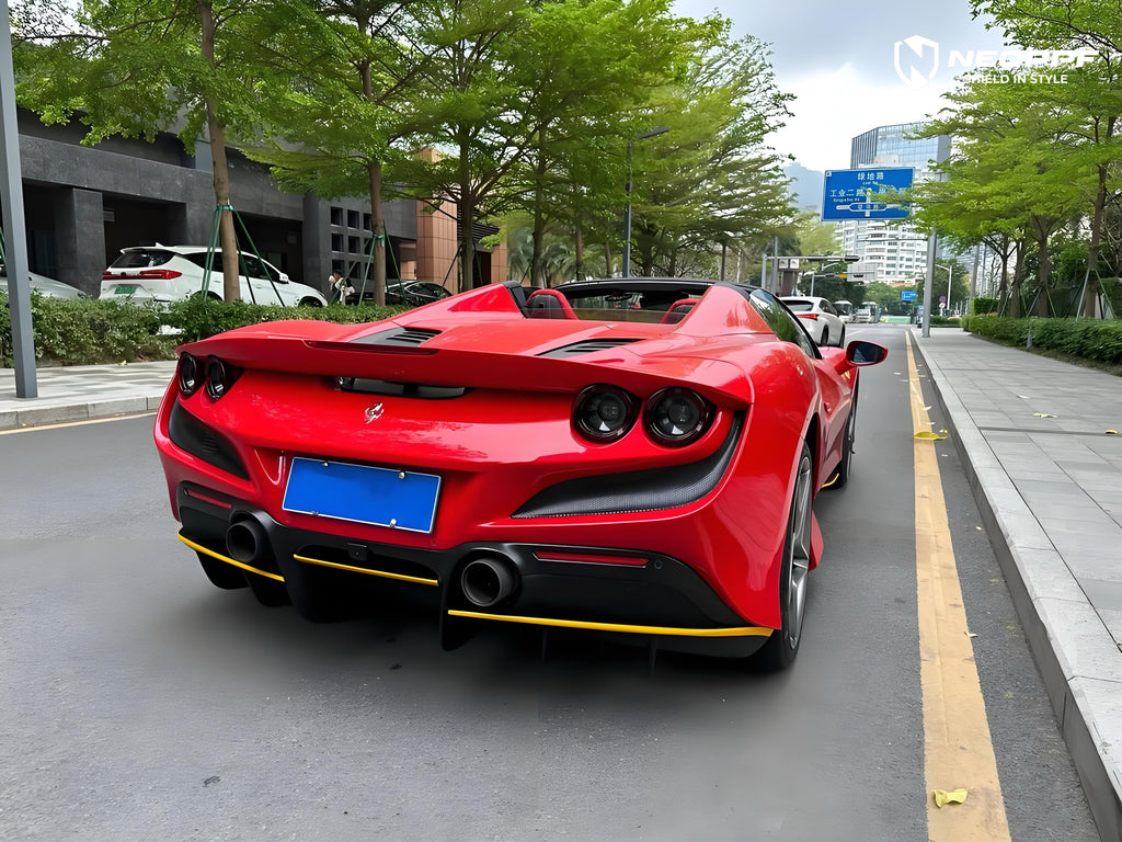 A sports car with Renovated Ferrari Red paint protection film colored wrap is parking in the garage