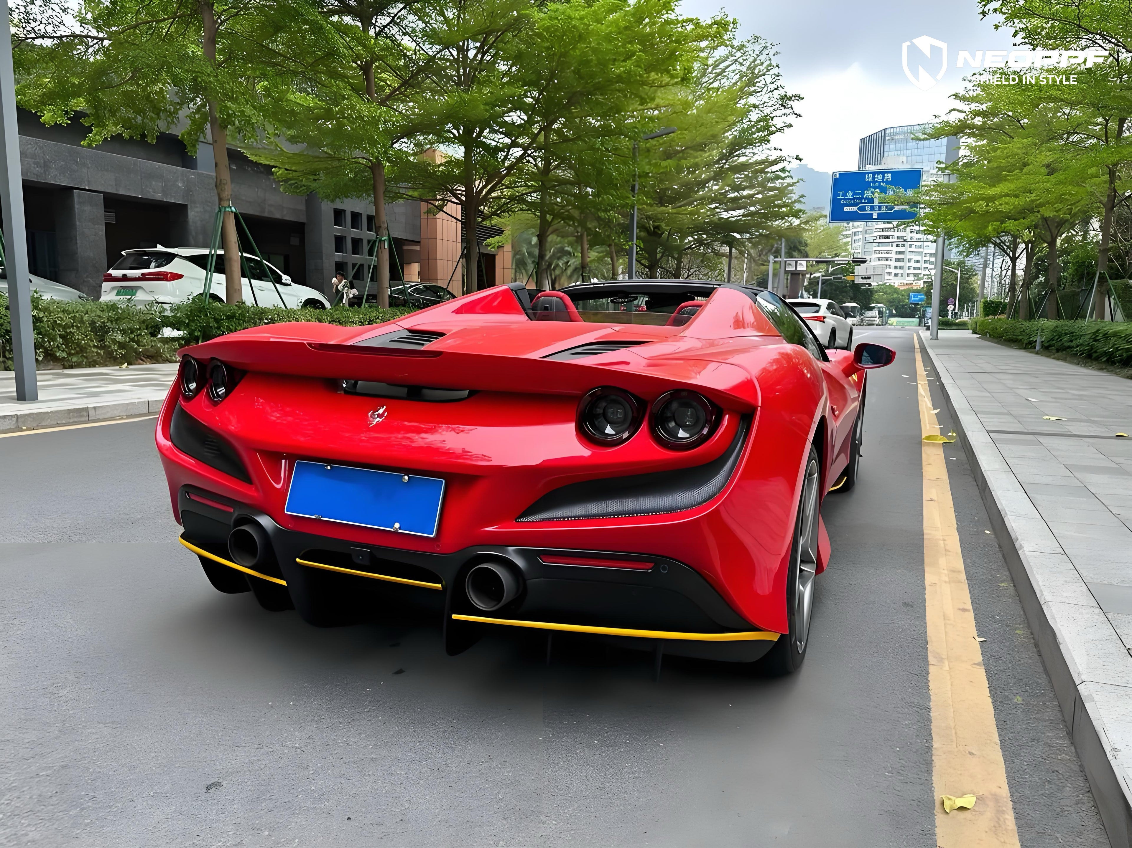 A sports car with Renovated Ferrari Red paint protection film colored wrap is parking in the garage