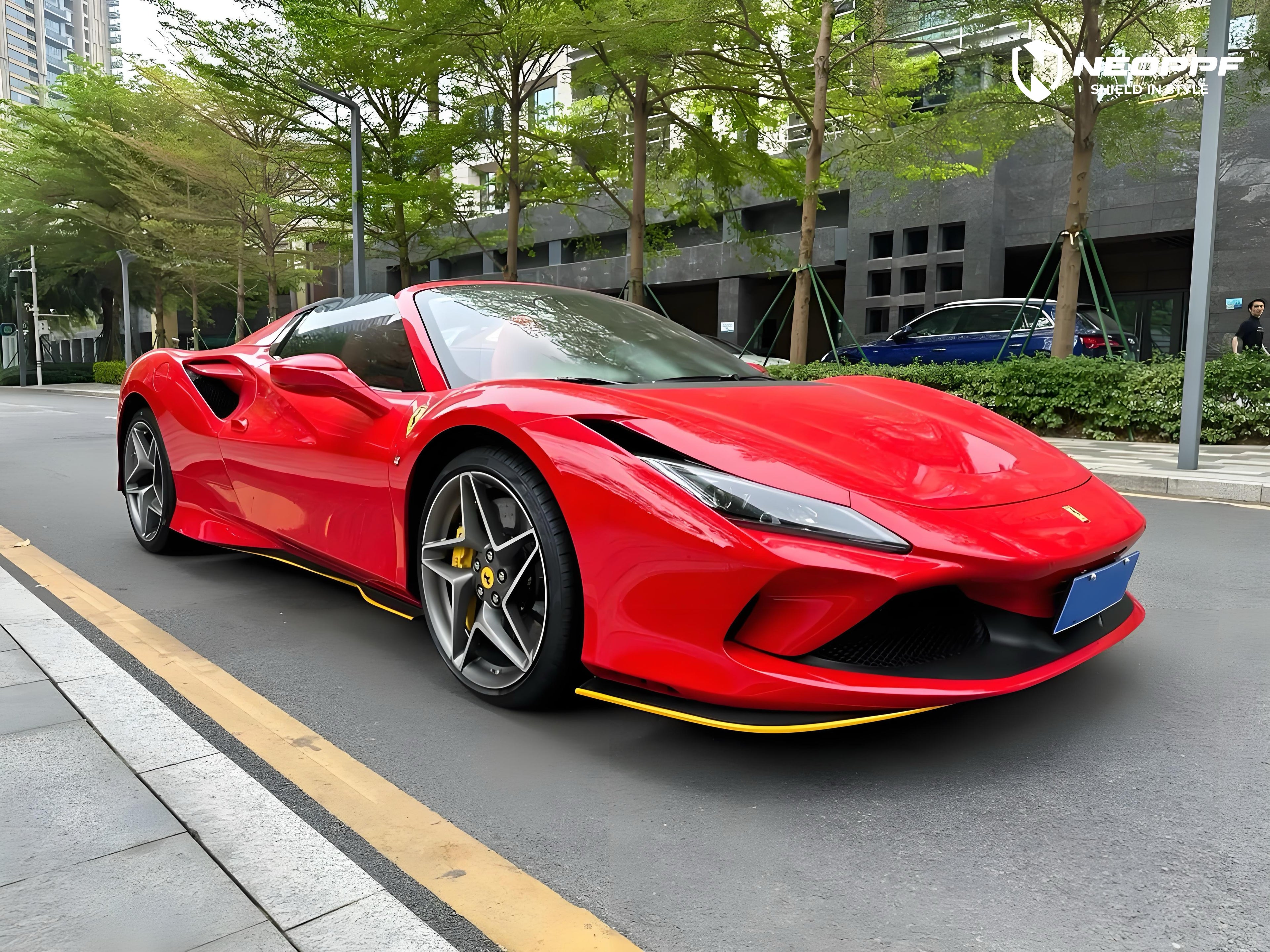 A sports car with Renovated Ferrari Red paint protection film colored wrap is parking in the garage