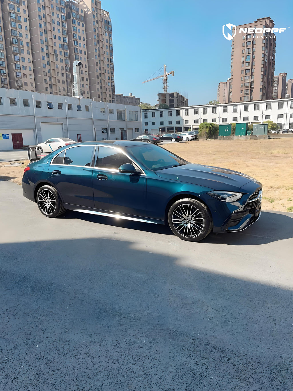 A sports car with Turquoise Green paint protection film colored wrap is parking in the garage