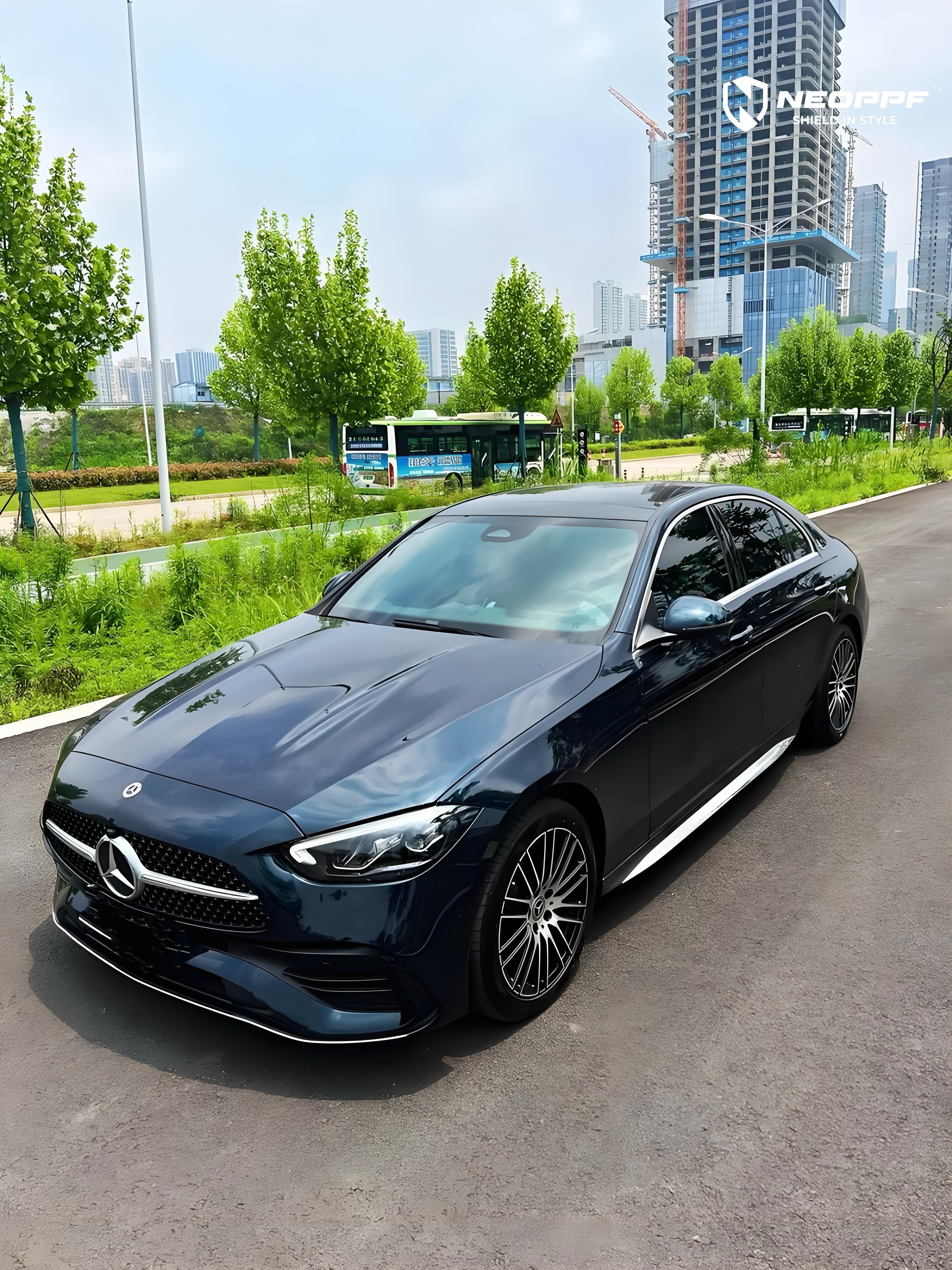 A sports car with Turquoise Green paint protection film colored wrap is parking in the garage